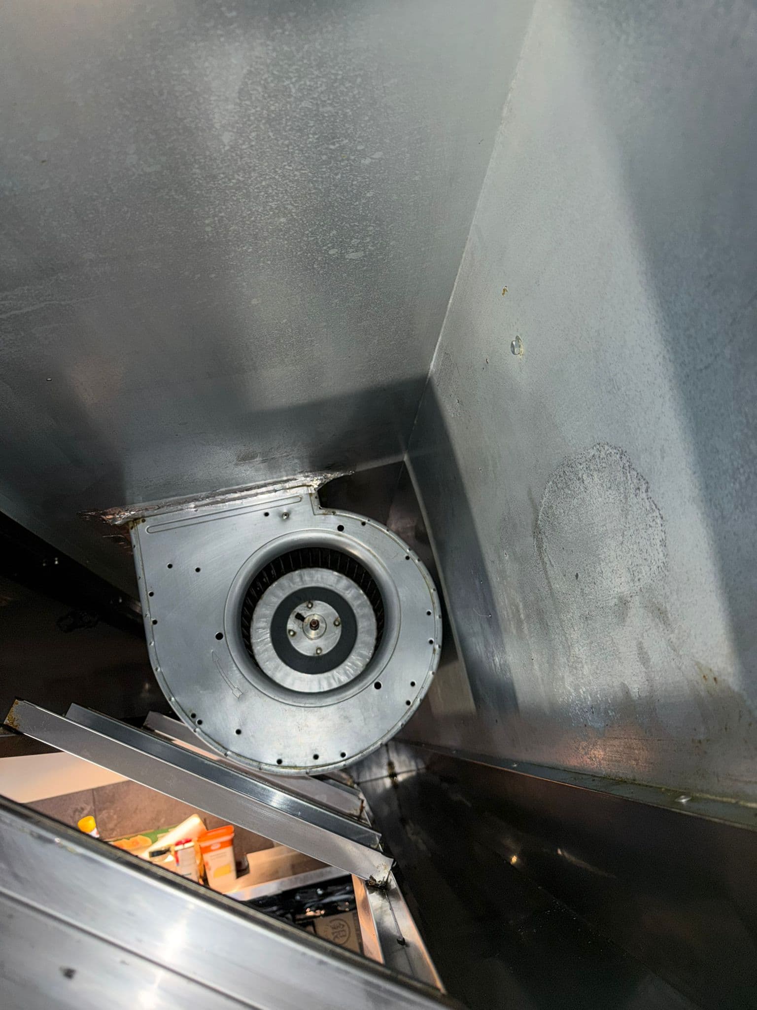 Cleaned fan unit inside a professional extraction system.
