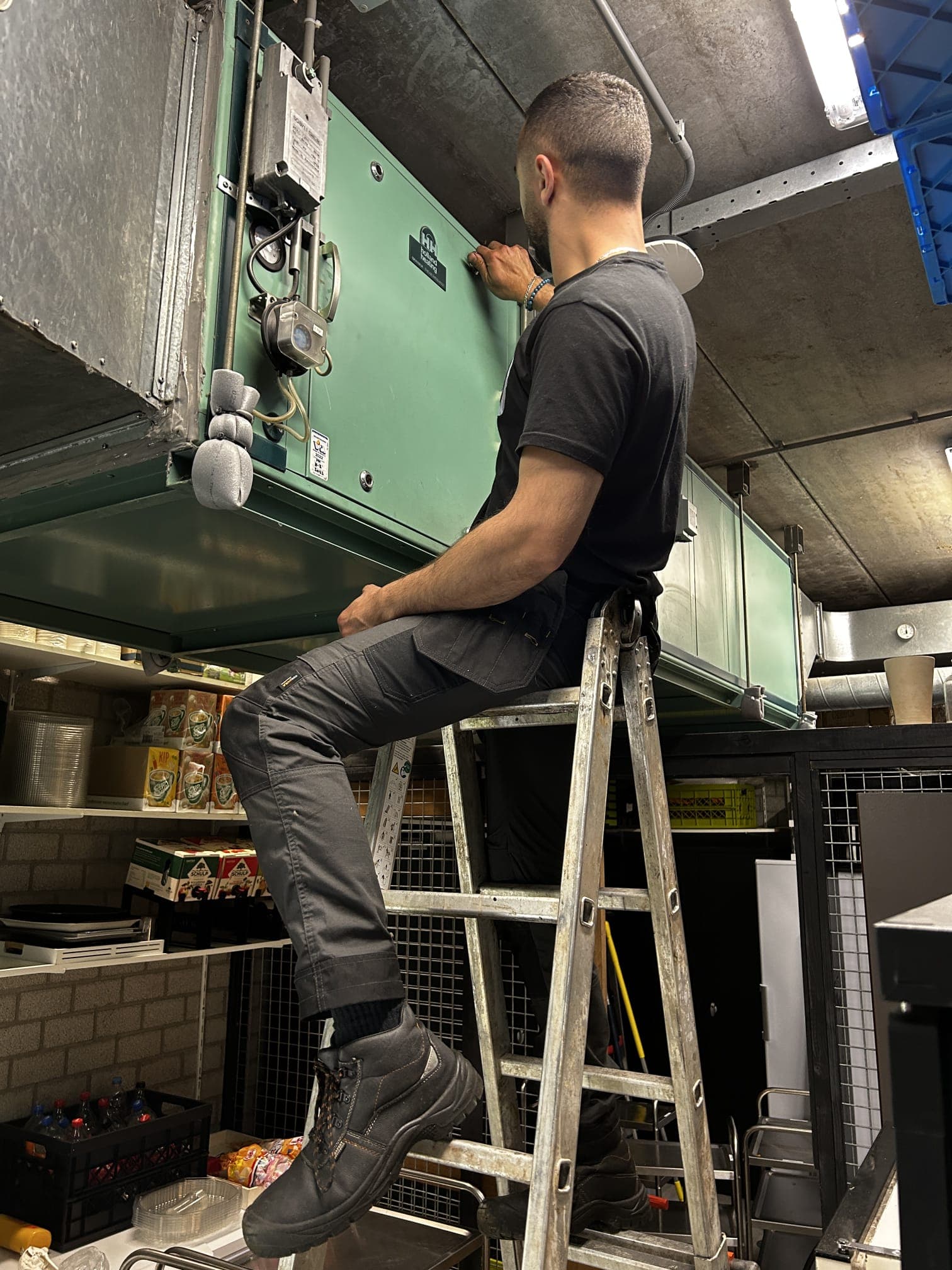 Technician servicing an air handling installation.