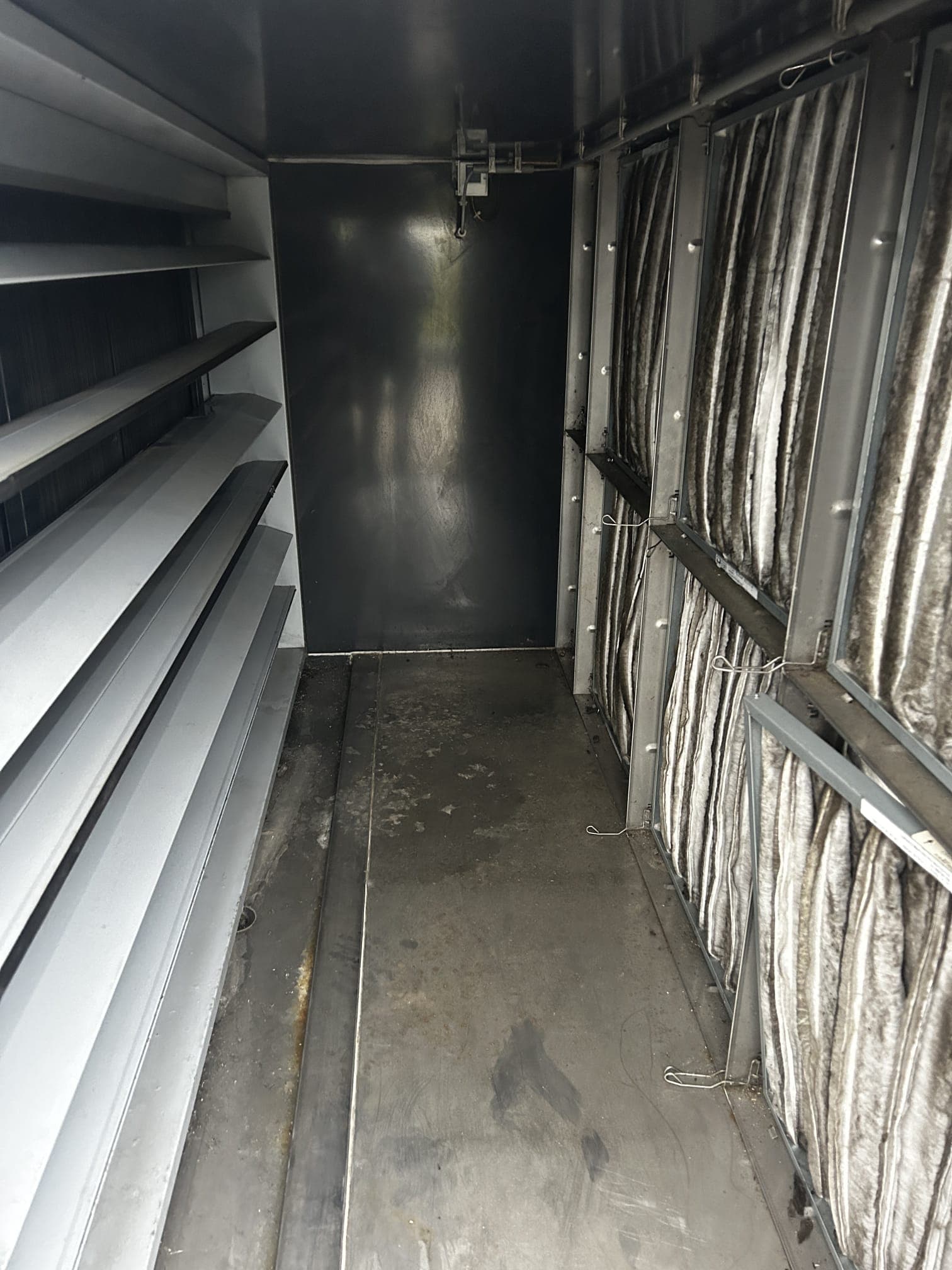 Interior of a ventilation system with filters and technical components.